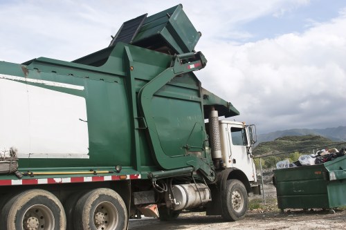 Investigator documenting evidence during inspection of a commercial waste site