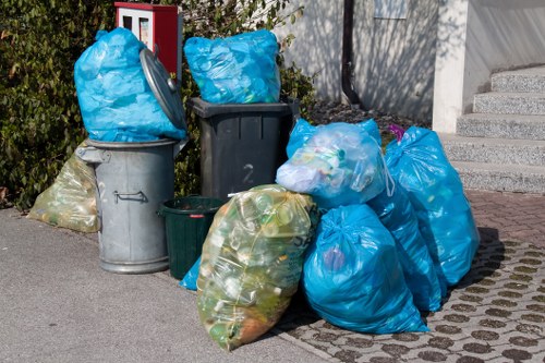 Workers sorting commercial recycling at a depot